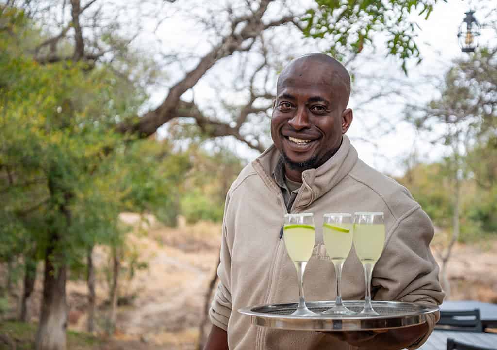 Refreshing drinks served outdoors at Idube Game Reserve, showcasing wildlife safari hospitality and authentic African safari experiences.
